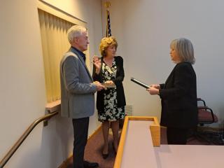Committeewoman Eileen Klose alongside her husband Mr. Klose, being sworn in by Township Clerk Kathleen Armstrong