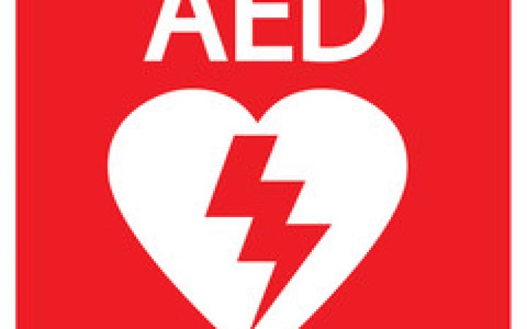 red AED sign with a white heart and lighting bolt down the center