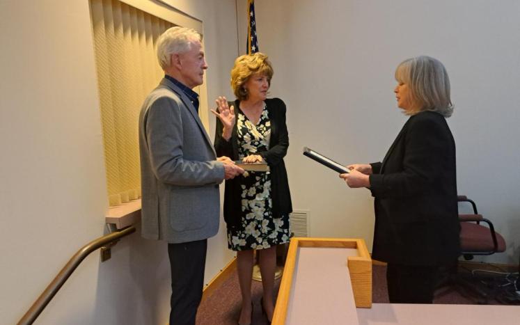 Committeewoman Eileen Klose alongside her husband Mr. Klose, being sworn in by Township Clerk Kathleen Armstrong