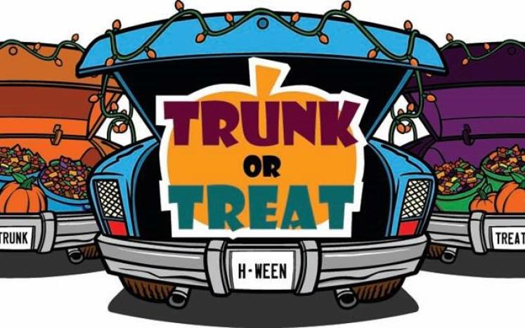 3 cars with their trunks opened with candy and the words trunk or treat
